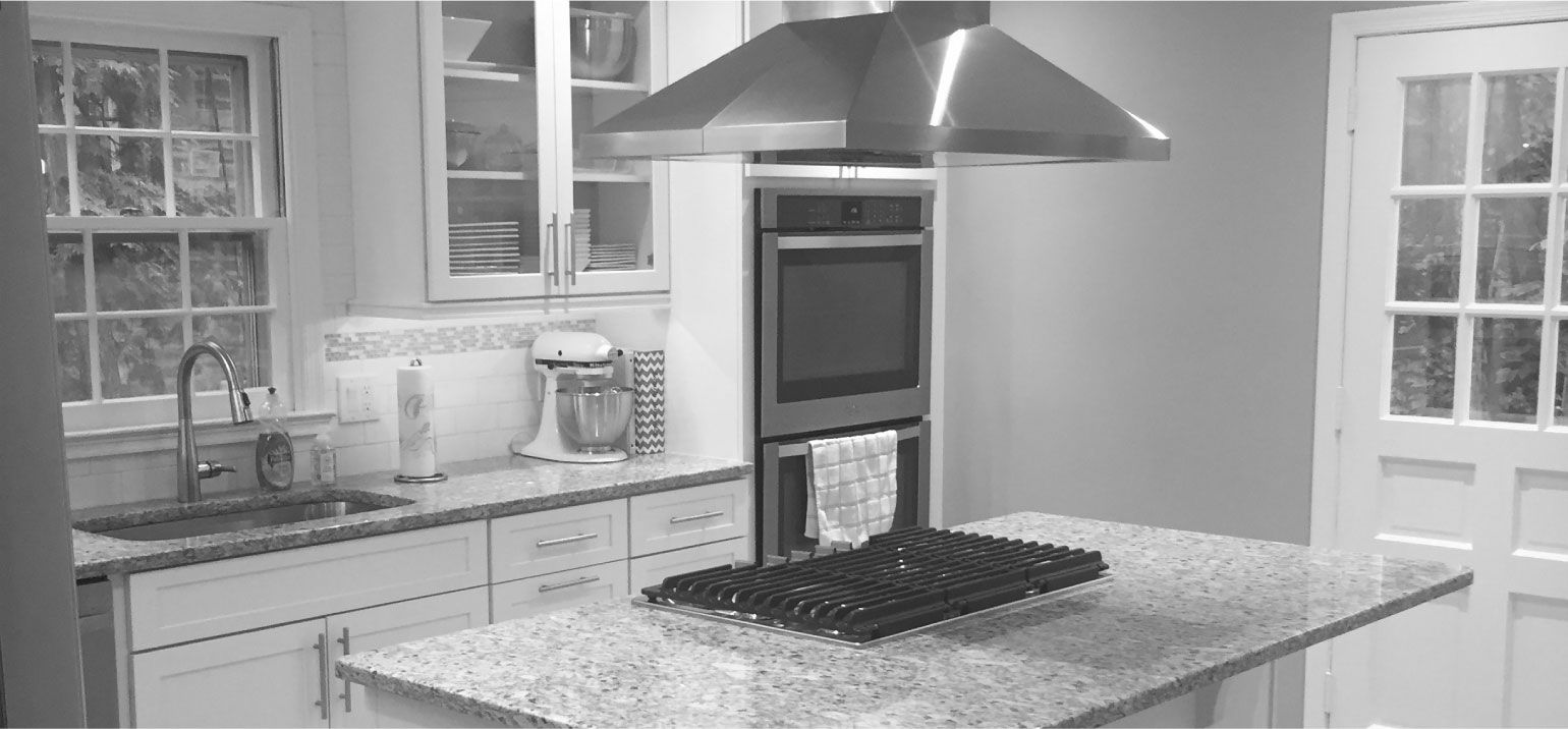 black and white image of a kitchen